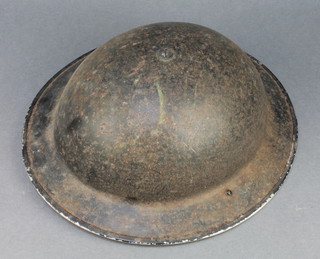 A Second World War steel helmet dated 1939 (minor rust)