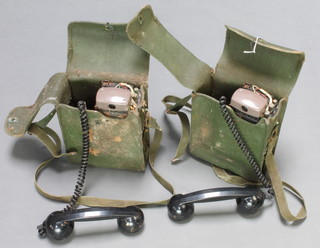 Two Military issue battery operated field telephones 