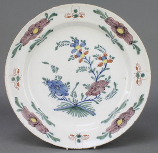 An 18th Century English polychrome Delft ware plate decorated with stylised flowers and insects 12 1/2"
