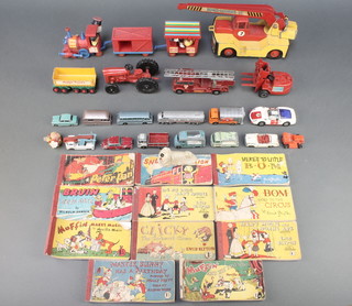 A Triang model train, a Corgi Magic Roundabout train with 3 figures and Dougal and other Triang cars and 11 small comic books