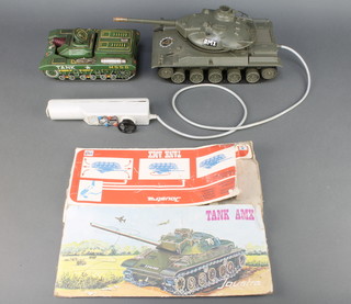 A Joustra tank AMX battery operated model complete with part section of box (in working order) together with a Japanese tin plate model tank 