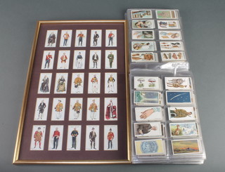 John Players a set of 25 framed cigarette cards - Ceremonial and Court Dress together with a large collection of loose cigarette cards including Wills Hidden Beauties, John Players etc 