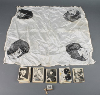 Sixty seven Beatles black and white picture cards together with a polyester headscarf decorated the 4 Beatles portraits 20 1/2" x 20 1/2" (slight stains and small moth hole)