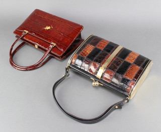 A brown leather handbag with gilt mounts 20" x 9 1/2" x 3" and a lady's crocodile handbag with gilt mounts 6 1/2" x 10" x 3" (slight damage to the side) 