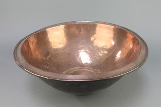A circular Eastern copper bowl 10" x 18" diam.