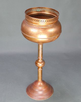 A circular copper jardiniere raised on a circular base 31" x 10", some dents