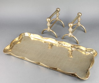 A pair of Benham Victorian brass fire dogs 6"h x 7"l together with a rectangular South African brass tray marked Made in South Africa by The Brassware Manufacturers Cape Town 1"h x 22"w x 9 1/2"d 