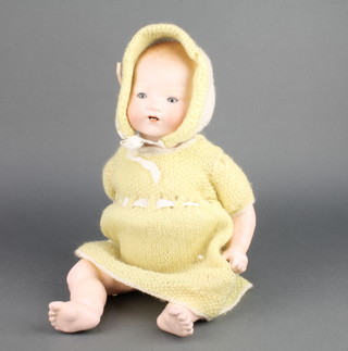 Armand Marseille a German porcelain headed doll with sleep eyes, open mouth with 2 teeth, head incised AM Germany 351./4.K