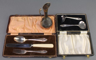 A silver pusher and spoon Sheffield 1933, a 3 piece Christening set and a plated ewer 