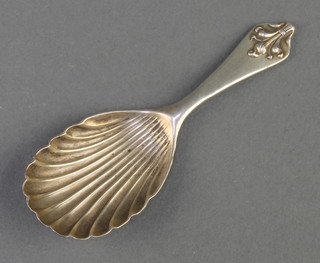 A silver caddy spoon with fancy handle and shell bowl London 1989 17 grams 