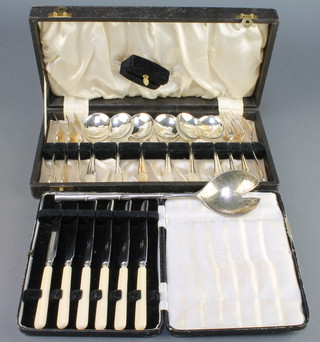 A cased set of plated dessert eaters, a cased set of knives and a serving spoon