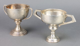 A silver 2 handled trophy cup Birmingham 1925, ditto with waisted stem Sheffield 1935, 360 grams 