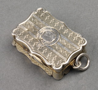 A Victorian silver vinaigrette with chased decoration and vacant cartouche with floral grill Birmingham 1861 