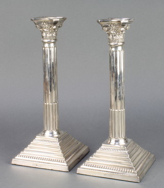 A pair of silver Corinthian column candlesticks 11 1/4" London 1967 