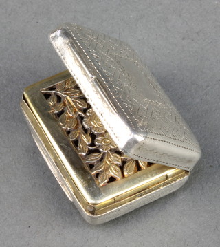 A George IV rounded rectangular silver vinaigrette with gilt floral grill Birmingham 1822 
