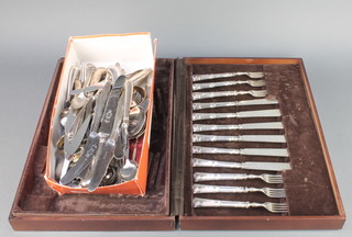A mahogany finished canteen and minor plated cutlery