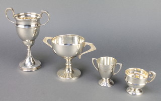 A silver 2 handled presentation trophy 7" Birmingham 1949, 3 other trophy cups 364 grams 