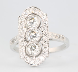 An 18ct white gold Art Deco style up finger ring comprising 3 brilliant cut diamonds surrounded by smaller brilliant cut diamonds approx. 1.4ct size N 1/2