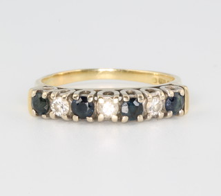 An 18ct yellow gold sapphire and diamond ring size O