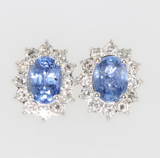 A pair of white gold oval sapphire and diamond ear studs, the sapphires approx 2.81ct the diamonds approx 0.87ct 