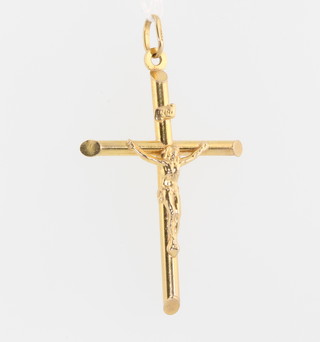 A 9ct yellow gold crucifix 2.7 grams 