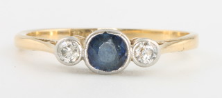 An 18ct yellow gold sapphire and diamond 3 stone ring, the centre sapphire approx. 0.3ct, flanked by brilliant cut diamonds approx. 0.14ctm, size O