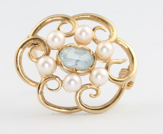 A 9ct gem set and pearl open scroll brooch