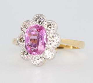 An 18ct yellow gold pink sapphire and diamond oval cluster ring, the centre stone approx 1.6ct surrounded by 8 brilliant cut diamonds approx. 0.9ct size O 