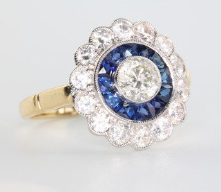 An 18ct yellow gold Art Deco style circular sapphire and diamond cluster ring size N 