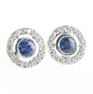 A pair of 18ct white gold sapphire and diamond cluster ear studs
