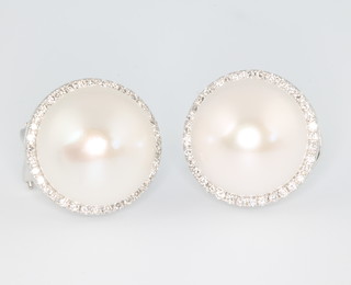 A pair of 18ct white gold cultured pearl and diamond ear clips 