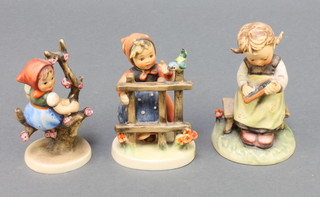 Three Hummel figures - Signs of Spring no. 203.3/0 4", a girl writing on a slate 367 4 1/2" and a girl in a blossom tree 4" 