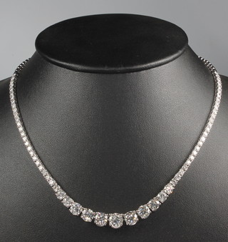A fine 18ct white gold brilliant cut 63 stone graduated diamond necklace, total weight approx. 15.7ct, 17" together with an EDR diamond report 