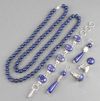A lapis lazuli style bracelet, a pair of earrings, cufflinks and a necklace
