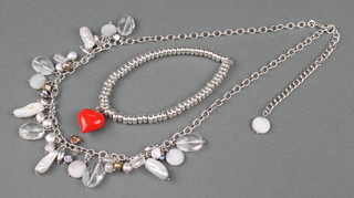 A silver bead bracelet with heart drop and a silver and baroque and mother of pearl necklace