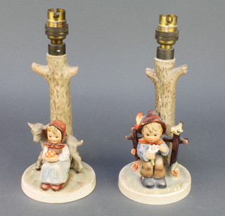 A pair of Hummel table lamps girl with a lamb no.228 10" and boy by a gate picking a flower no.227  10" 