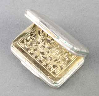 A 19th Century rounded rectangular silver vinaigrette with engine turned decoration and gilt interior 1 1/4" 