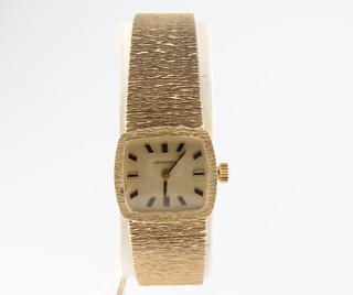 A lady's 9ct yellow gold Longines wristwatch with bark finished strap 31 grams 
