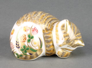 A Royal Crown Derby Imari pattern paperweight of a cottage garden kitten with silver stopper 2 1/2" 