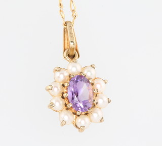 A 9ct yellow gold amethyst and seed pearl pendant and chain 