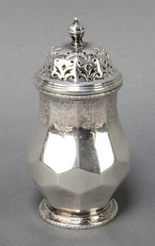 A silver octagonal sugar shaker with chased scroll decoration Birmingham 1929, 286 grams  
