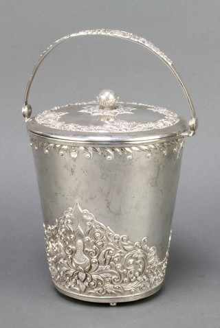 An 800 standard repousse silver ice bucket and drainer with swing handle 863 grams 7 1/2"