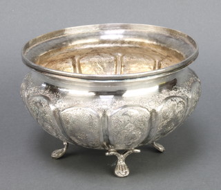 A repousse silver pedestal bowl with flowers and birds on pad feet 537 grams 