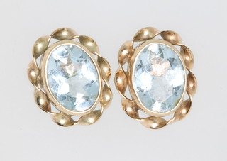 A pair of 9ct yellow gold topaz ear studs
