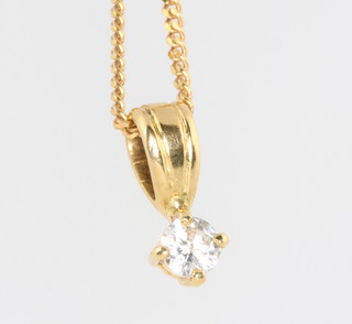 An 18ct yellow gold diamond pendant approx 0.3ct on a 9ct yellow gold chain