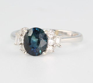 An 18ct white gold oval sapphire and diamond ring size L