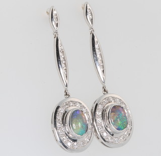 A pair of 18ct white gold oval opal and diamond drop earrings 