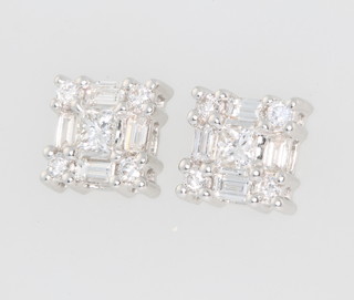A pair of 18ct white gold baguette and brilliant cut diamond ear studs 