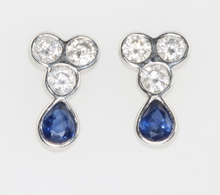 A pair of 18ct white gold sapphire and diamond ear studs the pear shaped sapphires approx. 0.94ct the brilliant cut diamonds approx 0.82ct 