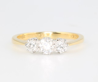 An 18ct yellow gold 3 stone diamond ring approx. 0.75ct, size O 